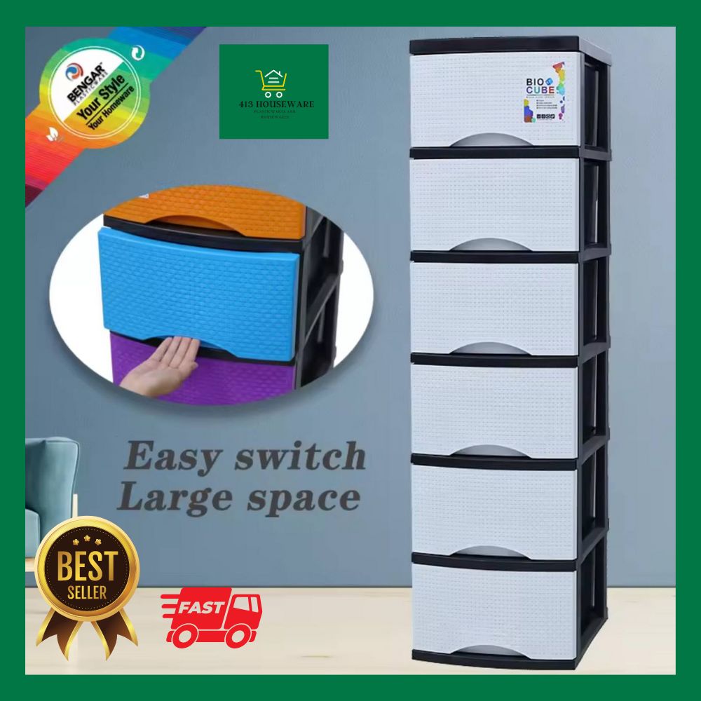 Stackable storage drawers with a hand holding a colorful container, on a gray background.